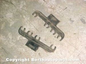 A 1964 Buick valve cover plug wire holders