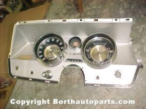 A 1964 Buick speedometer gauges clock bezel