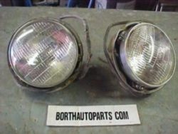 A 1950 Dodge head light and bucket rings